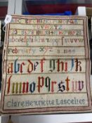 19th cent. Textiles: Woolwork alphabet sampler by Clare Henrietta Lancelles, Feb. 1844, unframed.