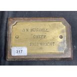 Nautical/Shipbuilding: Brass mounted on oak nameplate for J.W. Bushell Chief Shipwright. Records