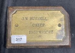 Nautical/Shipbuilding: Brass mounted on oak nameplate for J.W. Bushell Chief Shipwright. Records