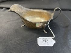 Hallmarked Silver: Cream jug scalloped border C scroll handle on three hoof feet, hallmarked