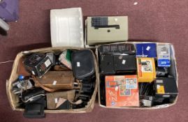 Cameras/Photographic Equipment: Two boxes containing many items including slide projector tripod,