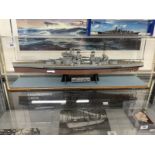 Cased model of H.M.S. King George V, 26ins. and a mimic model of The Bismarck.