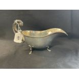 Hallmarked Silver: Sauce boat, gadroon border C scroll handle three trefoil feet, hallmarked