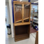 20th cent. Mahogany glazed top bookcase, two glass doors with three shelves above an open cupboard