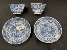 Chinese: K'ang-hsi period (Kang-Xi) tea bowl and saucer, blue and white floral pattern (