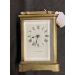 Clocks: Brass carriage clock white enamel face, Roman numerals, signed Jas Murray & Co. London/