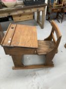 Pre-war oak and elm adjustable flip top child's school desk and bar back chair.