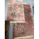 Carpets & Rugs: Chinese hand wash pink ground with blues, reds, greens and browns, a pair. 98ins.