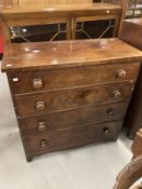 19th cent. Mahogany chest of four long drawers with turned knob handles, shaped plinth and bracket