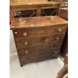 19th cent. Mahogany chest of four long drawers with turned knob handles, shaped plinth and bracket
