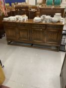 20th cent. Oak sideboard bears Old Charm furniture label, four short drawers with carved fronts