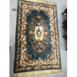 Carpets & Rugs: Chinese hand washed green ground with floral decoration in pinks, browns, greens and