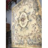 Carpets & Rugs: British made carpet, cream ground with floral decoration, ribbon and garland