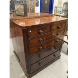 19th cent. Mahogany chest of two over four long drawers, turned knob handles on a plinth base.