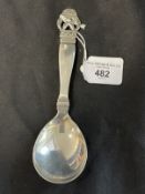 Scandinavian silver fruit spoon with pierced handle depicting a pair of dolphins with the name '