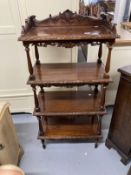 Late 19th cent. Mahogany four tier whatnot with carved gallery, each shelf with carved moulded