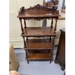 Late 19th cent. Mahogany four tier whatnot with carved gallery, each shelf with carved moulded