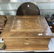 Late Victorian walnut cased table top polyphone with marquetry inlaid panel and a quantity of discs.