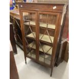 Edwardian two door display cabinet on square tapered legs inlaid with satinwood. 30ins. x 13½ins.