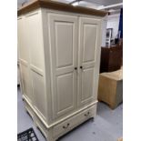 20th cent. Two door wardrobe with moulded oak cornice above two cream painted doors above a single