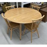 Mid 20th cent. Ercol ash oval drop leaf table and four model 391 stick back chairs with sticks