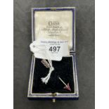 Jewellery: Yellow and white metal brooch in the form of an arrow set with nineteen rubies, estimated