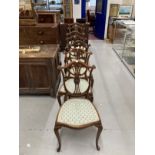 Edwardian inlaid mahogany Hepplewhite style chair, shield shaped backs, cabriole legs, two carvers