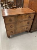 19th cent. Mahogany three long drawer chest on bun supports.