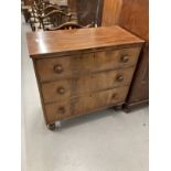 19th cent. Mahogany three long drawer chest on bun supports.