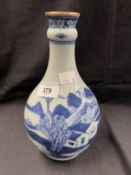 18th cent. Garlic head moulded guglet vase with building and landscape decoration. 9½ins.