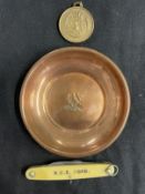 Militaria/Royal Navy: H.M.S. Hood copper ashtray, penknife, Hood Whalers Club medal. (3)