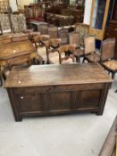 18th cent. Elm coffer peg jointed, panelled carving to the apron and panel mounts on the front and