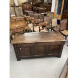 18th cent. Elm coffer peg jointed, panelled carving to the apron and panel mounts on the front and