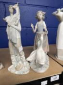 20th cent. Ceramics: Nao girl with geese, matt finish, 11ins. Shepherd boy with goat on his