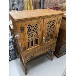 20th cent. Gothic style oak larder cupboard with two pierced and carved doors above a single fall,