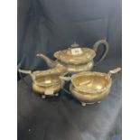 Hallmarked Silver: Three piece tea set teapot, milk jug and sugar bowl melon shaped bodies, scroll
