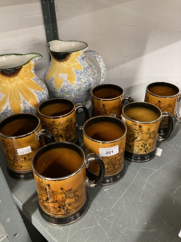 Ceramics: Poole pottery jugs decorated with sunflowers, a pair (½ins) and Arthur Wood mugs decorated