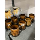 Ceramics: Poole pottery jugs decorated with sunflowers, a pair (½ins) and Arthur Wood mugs decorated