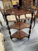 19th cent. Mahogany corner three tier whatnot with pierced gallery, serpentine shaped shelves,