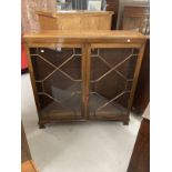 20th cent. Mahogany two door astragal glazed cabinet, moulded top on bracket feet. 48ins. x 48ins. x