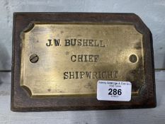 Nautical/Shipbuilding: Brass mounted on oak nameplate for J.W. Bushell Chief Shipwright. Records