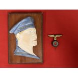 Militaria: Unusual ceramic Kriegsmarine plaque depicting a sailor mounted on board. 6½ins. Plus a