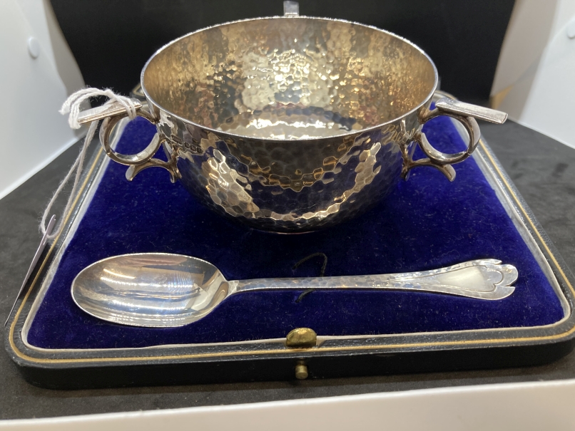 Hallmarked Silver: Art Nouveau three (scroll) handled bowl and spoon planished inside and outside,