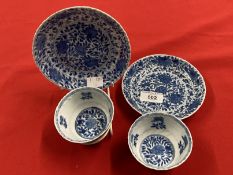 Chinese: K'ang-hsi period (Kang-Xi) tea bowl and saucer, blue and white floral pattern (