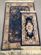 20th cent. Indian flower decorated rug. 72ins. x 48ins. Plus a larger 20th century rug.