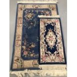 20th cent. Indian flower decorated rug. 72ins. x 48ins. Plus a larger 20th century rug.