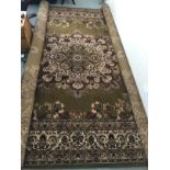 Rugs: Super Keshan green ground rug. Approx. 118ins. x 173ins.