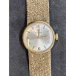 Watches: Ladies 9ct gold Omega bracelet watch, round silver coloured dial. Total weight 28.8g.