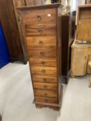 20th cent. Hardwood narrow ten drawer tall chest of drawers. 16ins. x 17ins. x 53ins.