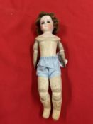 19th cent. Continental doll, porcelain head, kid leather jointed body, grey glass eyes, closed